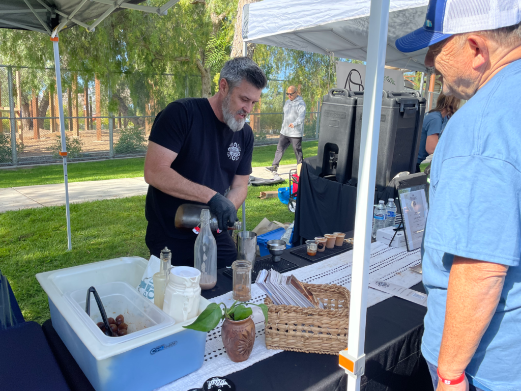 Man serving iced coffee at the park